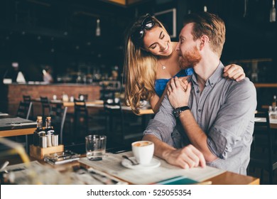 Beautiful Man And Woman Flirt In Cafe