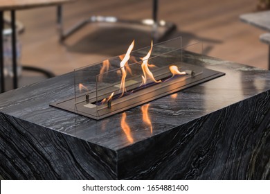 Beautiful Marble Black Floor Fireplace. Minimalism Interior, Alternative Bio Fireplot Fireplace On Ethanol Gas.