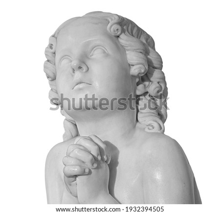 Beautiful marble statue of an pray infant angel isolated on white