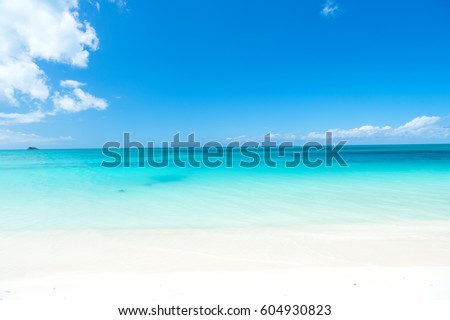 Beautiful marine view on caribbean sea coast line with clean wavy surf ocean water on sandy beach at sunny day as natural background with blue sky, st. john, Antigua