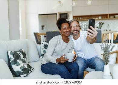 Beautiful married people taking photo with phone. - Shutterstock ID 1879769314