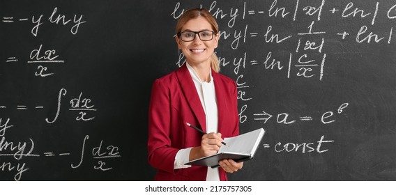 Beautiful Maths Teacher Near Blackboard Classroom Stock Photo ...