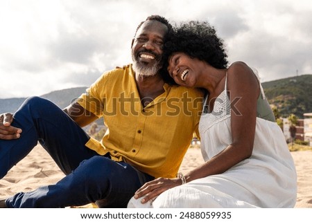 Image, Stock Photo Joyful couple laughing together on a vintage sofa