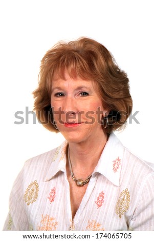 A beautiful mature Caucasian woman smiles for the camera during her fashion photo shoot. The perfect shot for all your Beautiful Mature Female needs. isolated on white with room for your text 