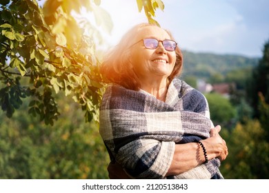 Beautiful Mature Happy Smiling Woman In Spring Garden Of Her Country House