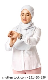 Beautiful Mature Muslim Woman Looking On Her Wrist Watch On White Background