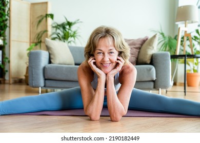 Beautiful Mature Senior Woman At Home, Domestic Life And Leisure Moments - 50-60 Years Old Pretty Female Adult Training In The Living Room