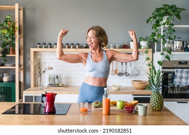 Beautiful Mature Senior Woman At Home, Domestic Life And Leisure Moments - 50-60 Years Old Pretty Female Adult Wearing Sportswear Eating Healthy Food After Fitness Workout