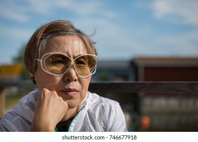 Beautiful Mature Taiwanese Chinese Woman Speaking During A Conversation.