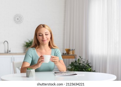 Beautiful Mature Woman Drinking Coffee At Home