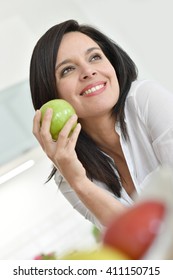 Beautiful Mature Woman Eating Green Apple