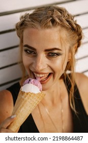 Beautiful Mature Woman Eating Ice Cream In A Waffle Cone.