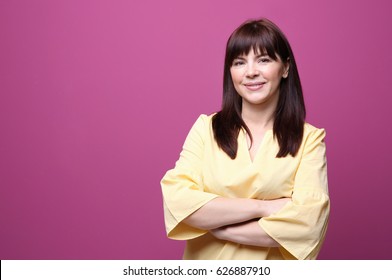 Beautiful Mature Woman On Color Background