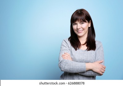 Beautiful Mature Woman On Color Background