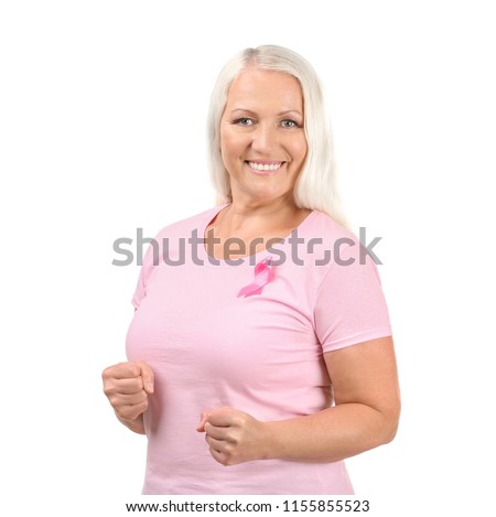 Beautiful mature woman with pink ribbon on white background. Breast cancer concept
