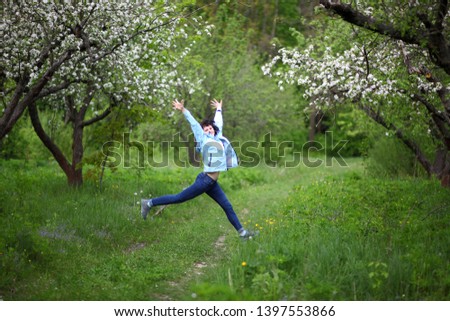 Similar – beautiful young woman having fun outside in park