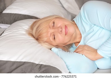 Beautiful Mature Woman Sleeping In Bed At Home