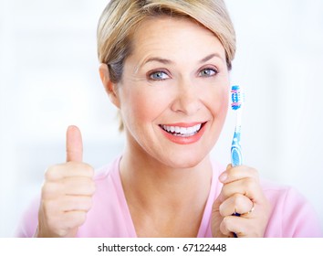 Beautiful Mature Woman With A Toothbrush.