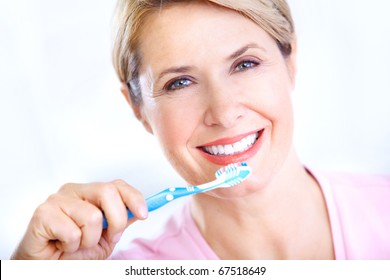 Beautiful Mature Woman With A Toothbrush.