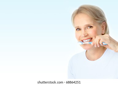 Beautiful Mature Woman With A Toothbrush.