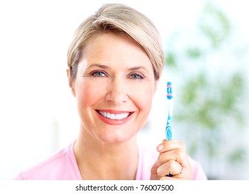 Beautiful Mature Woman With A Toothbrush.  Dental Health