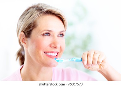 Beautiful Mature Woman With A Toothbrush.  Dental Health