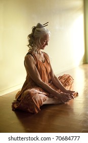 Beautiful Mature Woman In Yoga Pose Baddhakonasana.