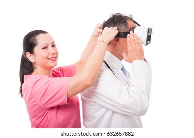 Beautiful Medical Nurse Putting Vr Goggles On Medic Head As Imaginary Or Virtual Reality Concept Isolated On White Background