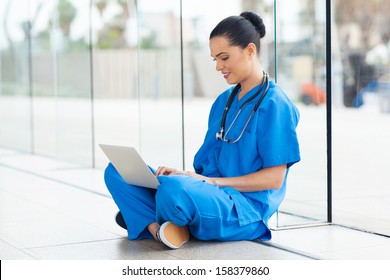 Beautiful Medical Nurse Working On Laptop