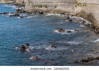 Beautiful Mediterranean Coastline Under Blue Sky In Antibes - City On French Riviera Between Cannes And Nice.