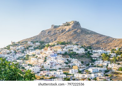 Beautiful mediterranean greek village Pantelis sourrounded by a mountain with ancient castle located at the aegean sea with colorful houses and lovely churches basilicas, Leros, Dodecanese, Greece - Shutterstock ID 797222536