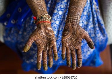 Beautiful Mehndi tattoo. Woman Hands with black henna tattoos