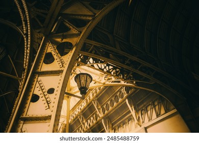 A beautiful metal roof with arches and a retro-style lantern at the train station. The bright rays of the sun shine through the roof, creating a magical atmosphere. - Powered by Shutterstock