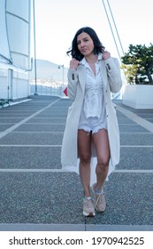 A Beautiful Mexican Woman Walking Gracefully In Canada Place, Canada 