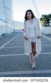 A Beautiful Mexican Woman Walking Gracefully In Canada Place, Canada 