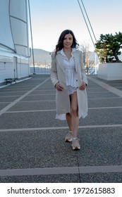 A Beautiful Mexican Woman Walking Gracefully In Canada Place, Canada 