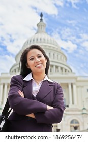 Beautiful mid adult Asian American woman in front of the U.S. Capitol building in Washington, DC