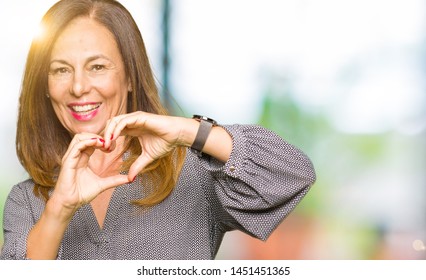 Beautiful Middle Age Business Woman Smiling In Love Showing Heart Symbol And Shape With Hands. Romantic Concept.