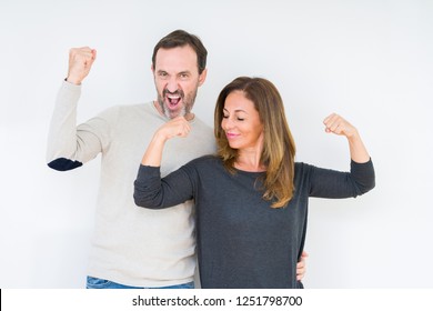 Beautiful Middle Age Couple In Love Over Isolated Background Showing Arms Muscles Smiling Proud. Fitness Concept.