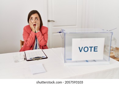 Beautiful Middle Age Hispanic Woman At Political Election Sitting By Ballot Tired Hands Covering Face, Depression And Sadness, Upset And Irritated For Problem 