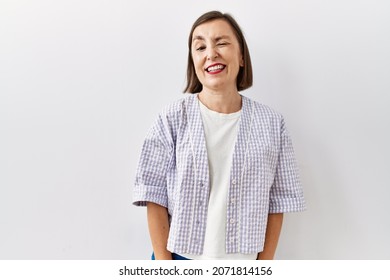 Beautiful middle age hispanic woman standing over isolated background looking unhappy and angry showing rejection and negative with thumbs down gesture. bad expression.  - Shutterstock ID 2071814156
