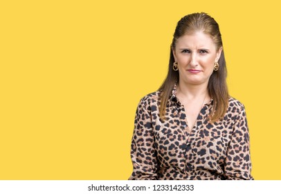 Beautiful Middle Age Mature Rich Woman Wearing Leopard Dress Over Isolated Background Skeptic And Nervous, Frowning Upset Because Of Problem. Negative Person.