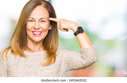 Beautiful Middle Age Woman Wearing Fashion Sweater Smiling Pointing To Head With One Finger, Great Idea Or Thought, Good Memory