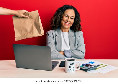 Beautiful Middle Age Woman Working At The Office Ordering Delivery Food Happy Face Smiling With Crossed Arms Looking At The Camera. Positive Person. 