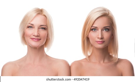 Beautiful middle aged mother and her adult daughter in studio