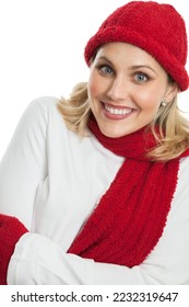 Beautiful middle aged woman dressed in a red knit hat, mittens and scarf with arms folded isolated on a white background - Shutterstock ID 2232319647