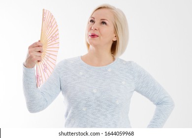 Beautiful Middle Aged Woman With Menopause Blowing By Fan. Hormone Replacement Therapy And Mature Woman Healthcare. Mid Age Happy Women Lifestyle. Senior Woman Isolated On White Background