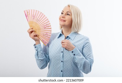 Beautiful Middle Aged Woman With Menopause Blowing By Fan. Hormone Replacement Therapy And Mature Woman Healthcare. Mid Age Happy Women Lifestyle. Senior Woman Isolated On White Background