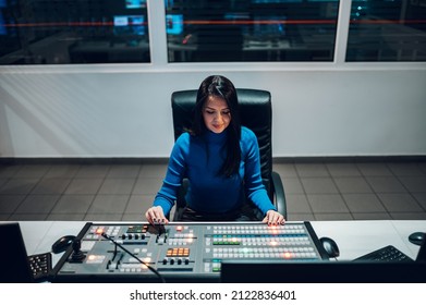 Beautiful Middle Aged Beautiful Woman Working On A Tv Station As A Producer In A Broadcast Control Room. Show Production Maker. Television.