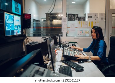 Beautiful Middle Aged Beautiful Woman Working On A Tv Station As A Producer In A Broadcast Control Room. Show Production Maker. Television.